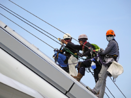 Climbing men on roof